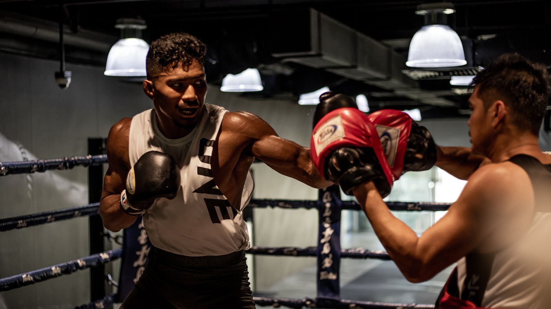 Amir Khan throws a hook in boxing