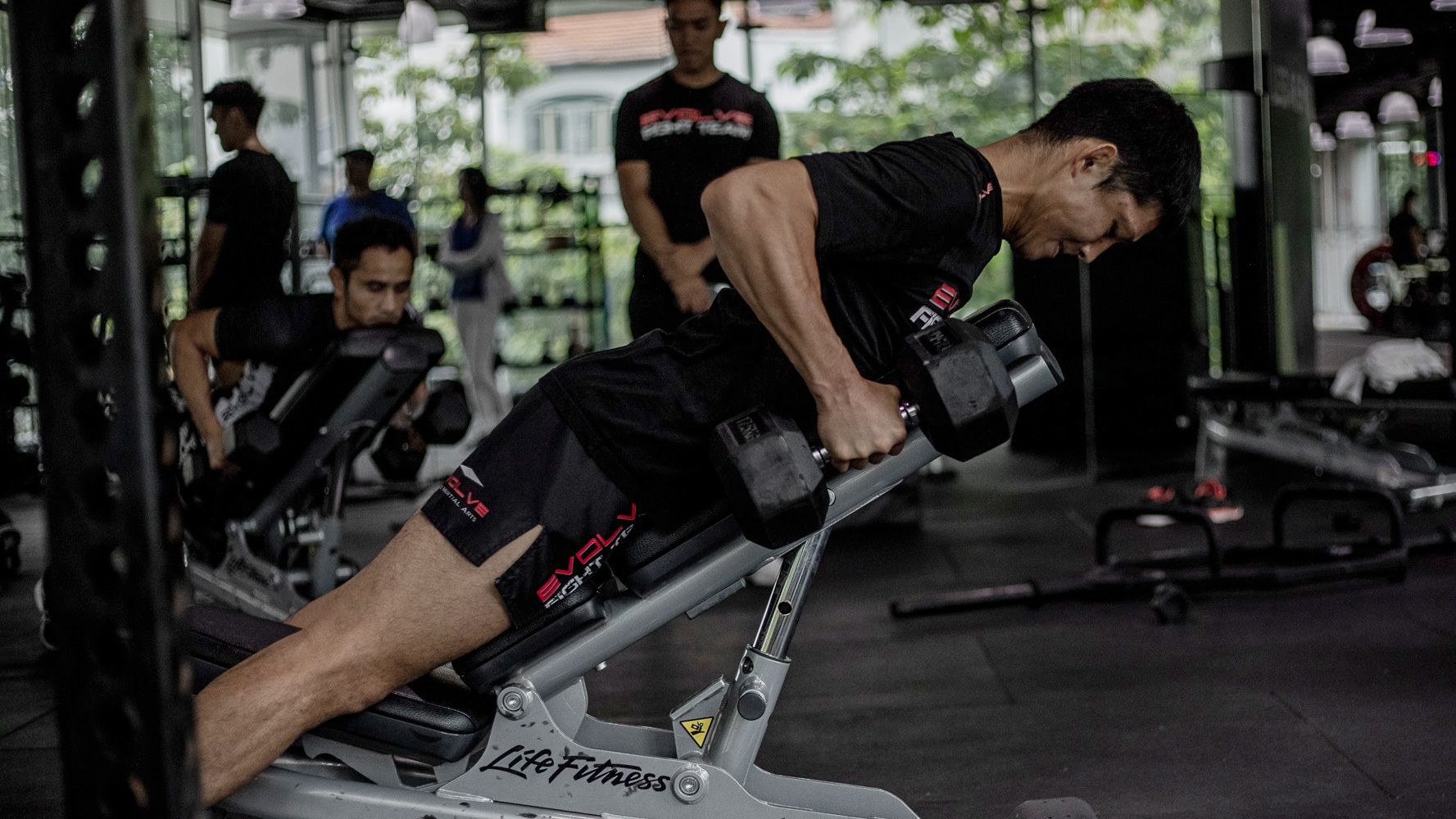 a person performing a dumbbell row