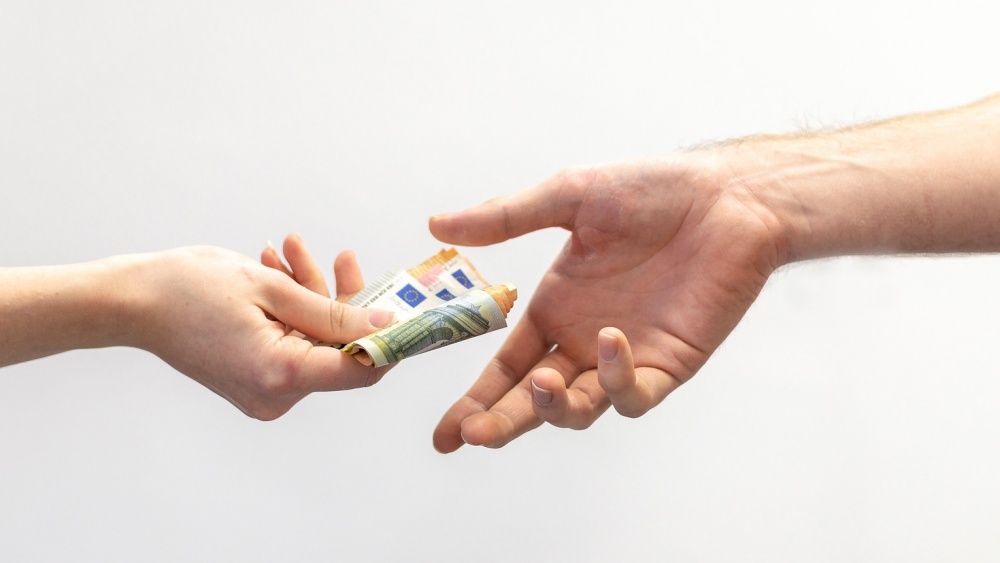 handing over money